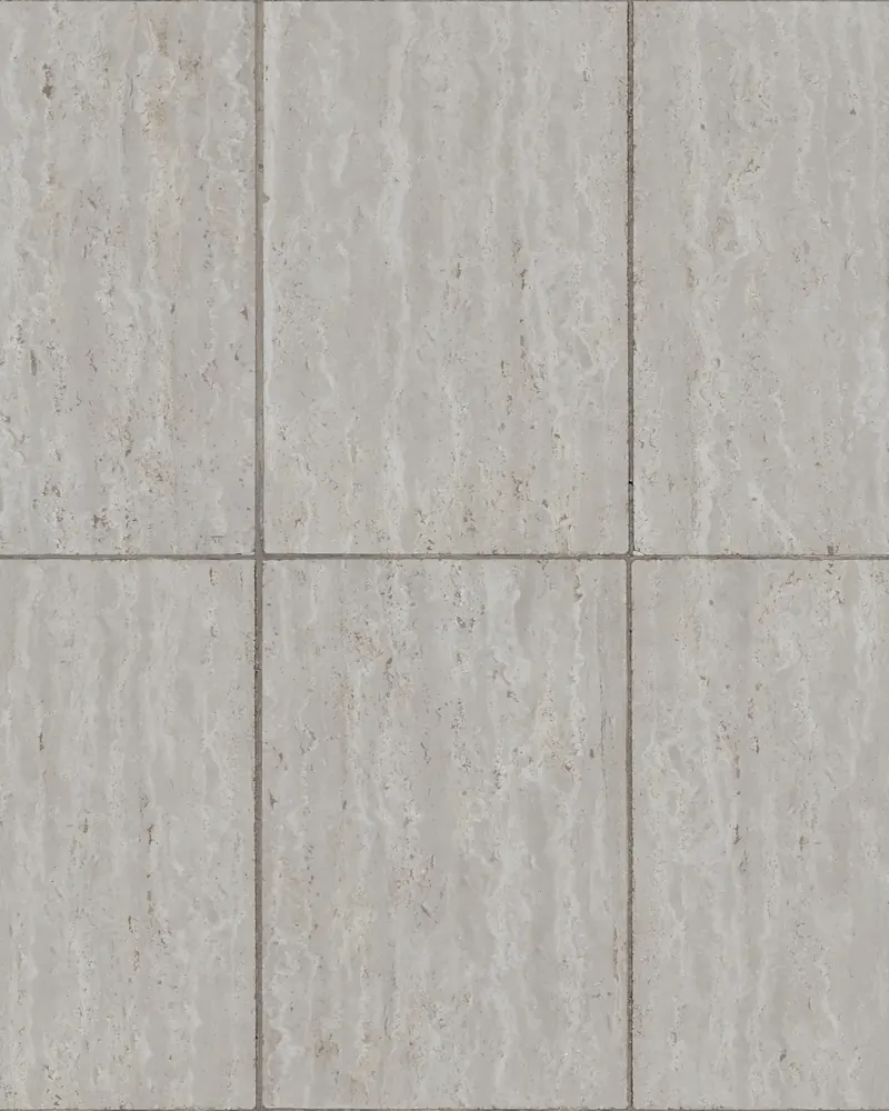 Travertine, its open pores and banded cream surface honed smooth.